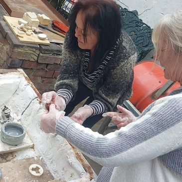Raku firing takes place in the courtyard where the fired work is glazed then fired in a raku kiln th