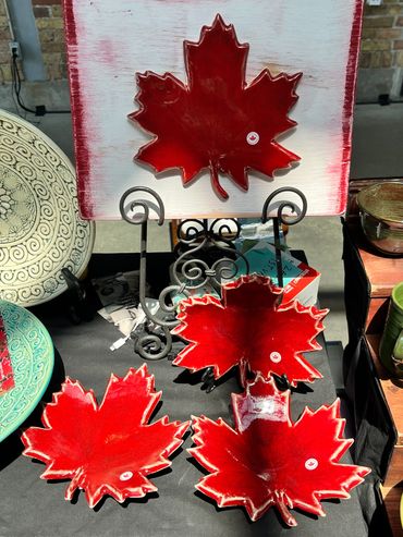 Red maple leaf-shaped ceramic dishes.