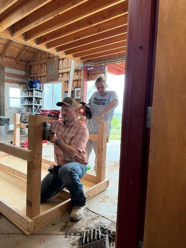 Joe and Katie building a table at Skyfall Ranch