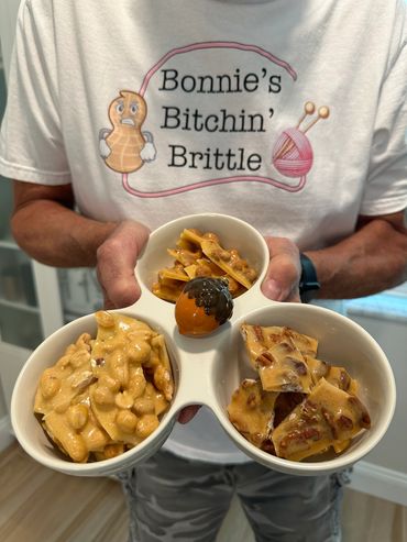 Three types of candy brittle displayed in a dish
