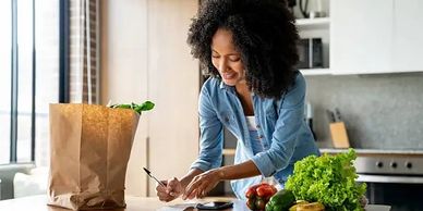 Customer writing grocery list