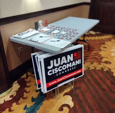 Yard signs and buttons for Juan Ciscomani
