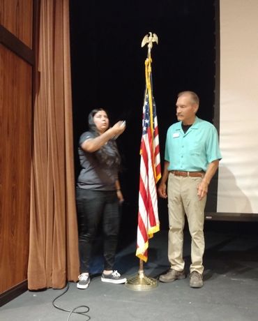 Preparing for pledge of allegiance at the August meeting of RRAZRC
