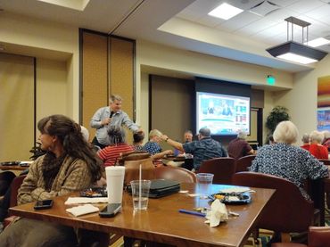 Club members gather to eat and monitor election results