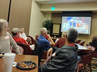 Club members gather to eat and monitor election results