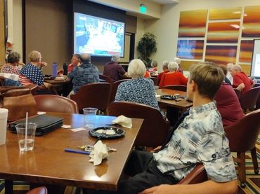 Club members gather to eat and monitor election results