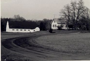 A black and white photo of a farm