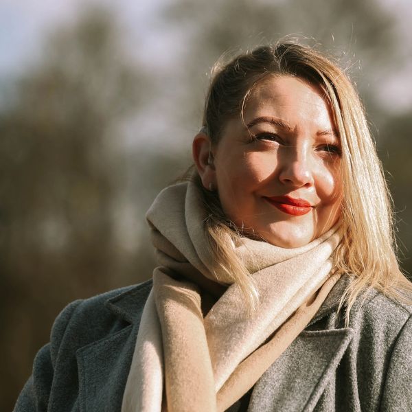 Kerry Tidman founder smiling with a forest background. She has blonde hair