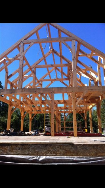 Timber framing, post and beam, luxury homes, handcrafted beams, bespoke design.