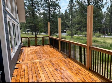 Modern wood deck, pergola posts, deck railing, backyard upgrade, patio design, outdoor space.