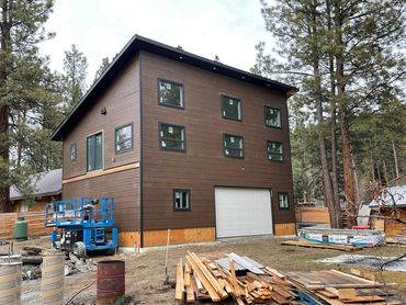 Cairrage home, barn dominium, custom deck, siding, garage doors, landscaping, custom kitchen, high e