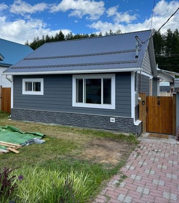 Hardy plank siding, smart trim, and a complete remodel of their existing garage including a new roof