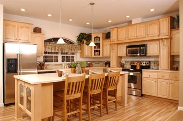 Refinished kitchen island, cabinets and hardwood floors