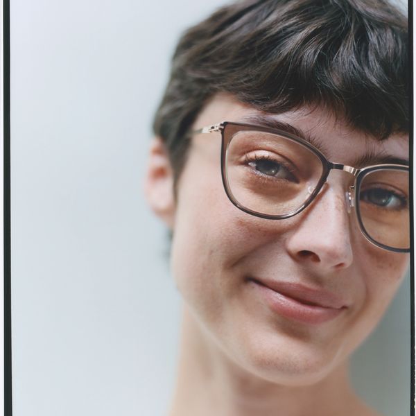 Lady smiling wearing sustainable brand Mykita glasses