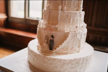 Castle wedding cake with handmade bride and groom