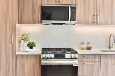 8900 Ramsgate - LG Gas Stove and LG Microwave. Custom Kitchen Cabinets with LED Lightning.