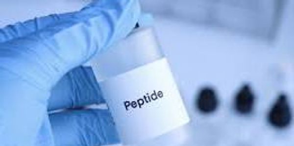 Gloved hand holding a small bottle labeled 'Peptide'.