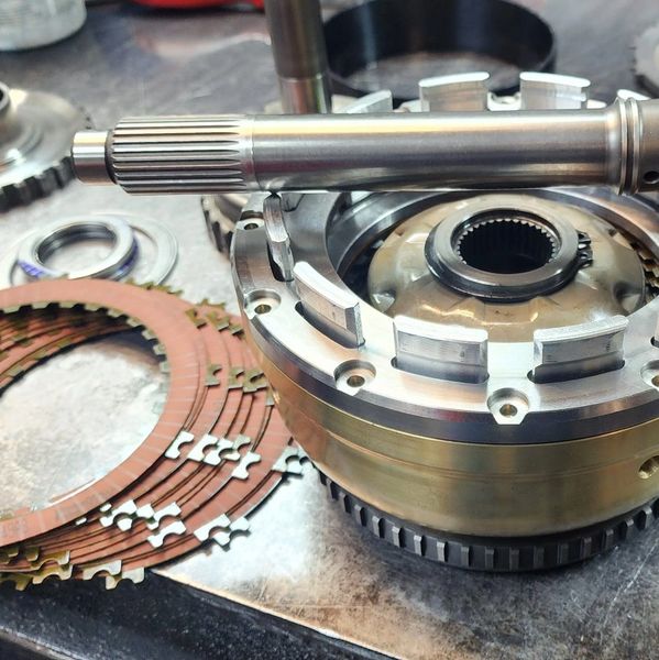 Close-up of mechanical parts on a workbench.