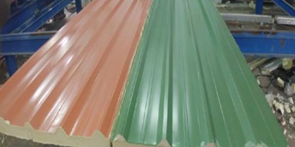 Two colored metal roofing sheets, one orange and one green.