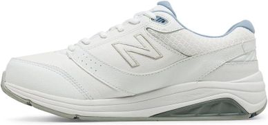 White New Balance sneaker with a cushioned sole and subtle gray accents.