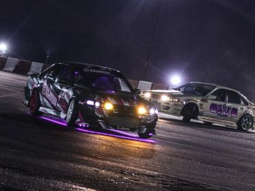 Drift cars racing at night