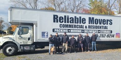 The Moving crew, owner Mike, and the 30 foot moving truck.