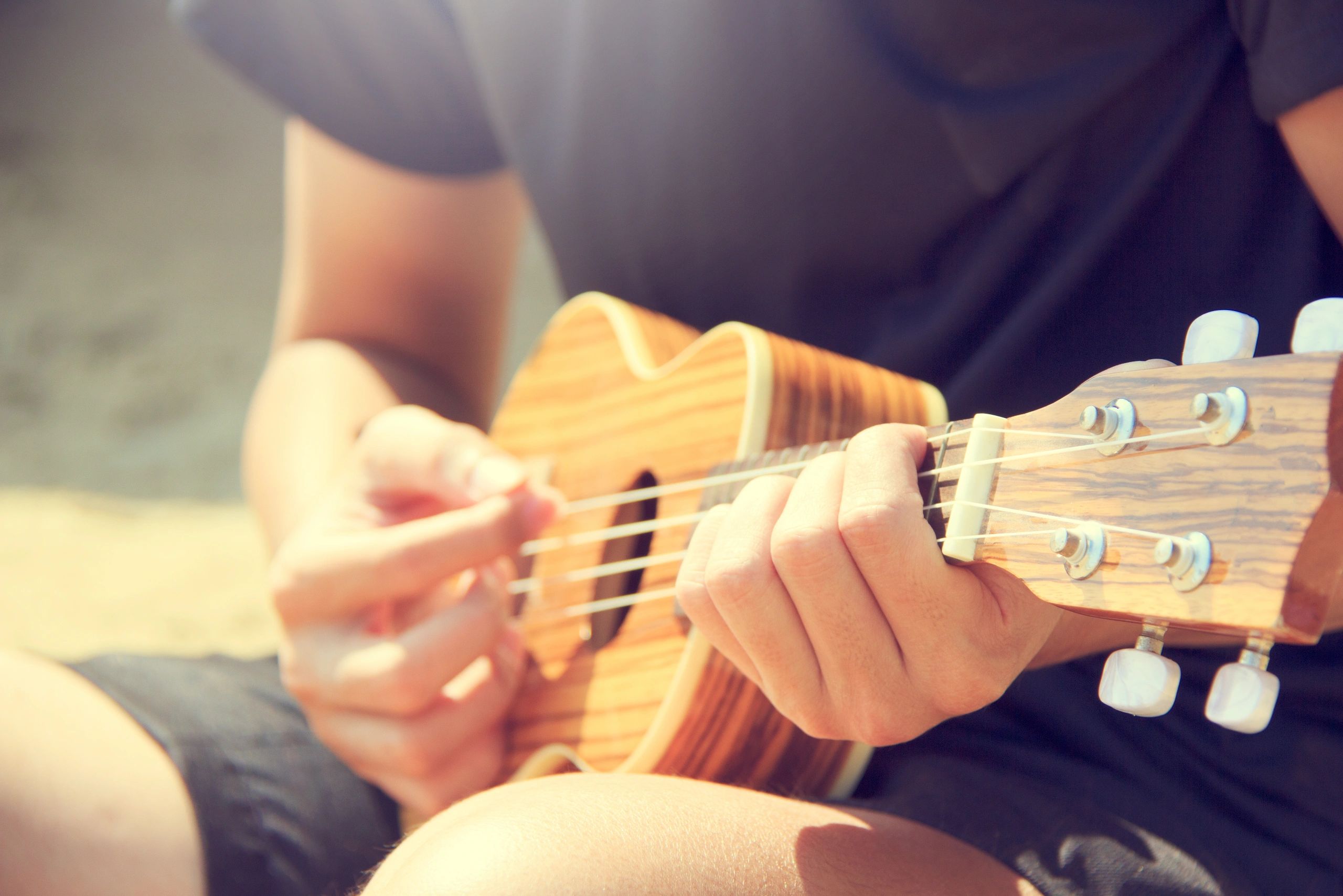 Student playing Tobias Ukulele