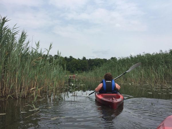 Woman kayaking in a Michigan lake.