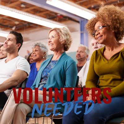 Image of many residents in an auditorium for a meeting