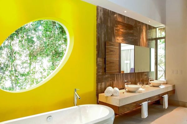 Relaxing in a bespoke bathroom. bath top with marble flooring, a forest view in Puerto Vallarta. 