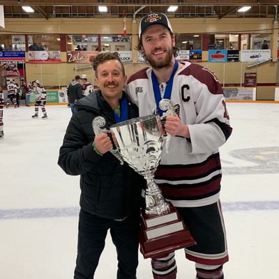 Athletic Therapist with hockey player - the Grizzlies of Revelstoke after winning the Teck cup KIJHL