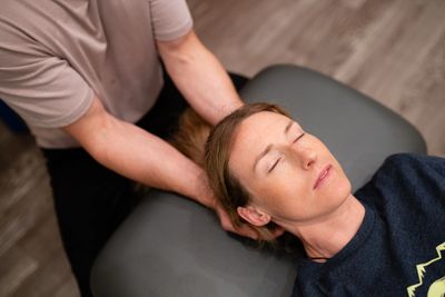 Manual osteopath doing a cranio sacral therapy. good for energy, headaches and pain reduction