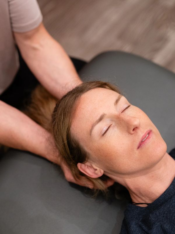 Phyio releasing the suboccipitals and cranium to help reduce headaches following a concussion