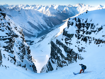 athletic therapist from revelstoke skiing down forever young couloir. He is agile and resilient