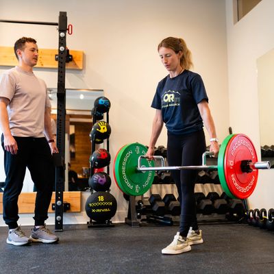 Downhill mountain bike athlete doing a split squat with trap bar do improve leg strength