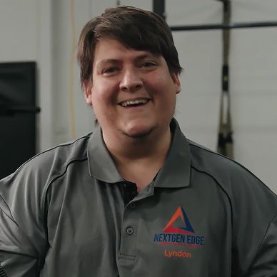 Man smiling wearing a NextGen Edge shirt.