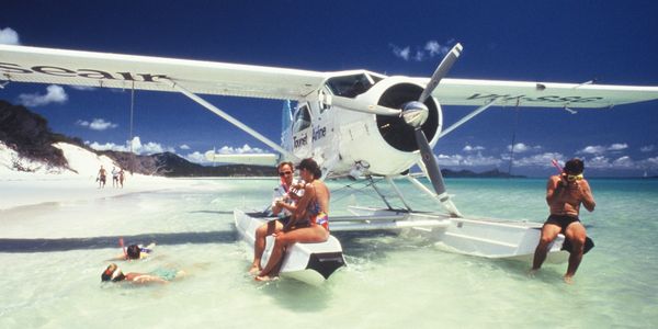 Beaver floatplane at whitehaven beach in the whitsundays with the pilot and guests fun snorkelling