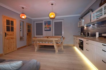 open plan kitchen with double sofa bed