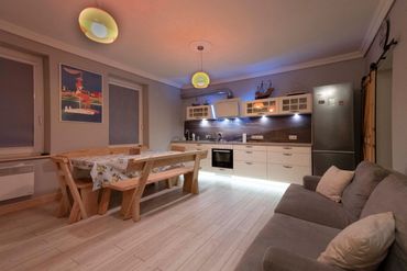 open plan kitchen with double sofa bed
