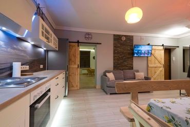 open plan kitchen with double sofa bed