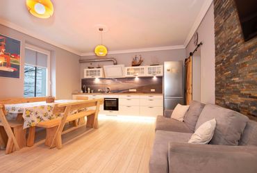open plan kitchen with double sofa bed