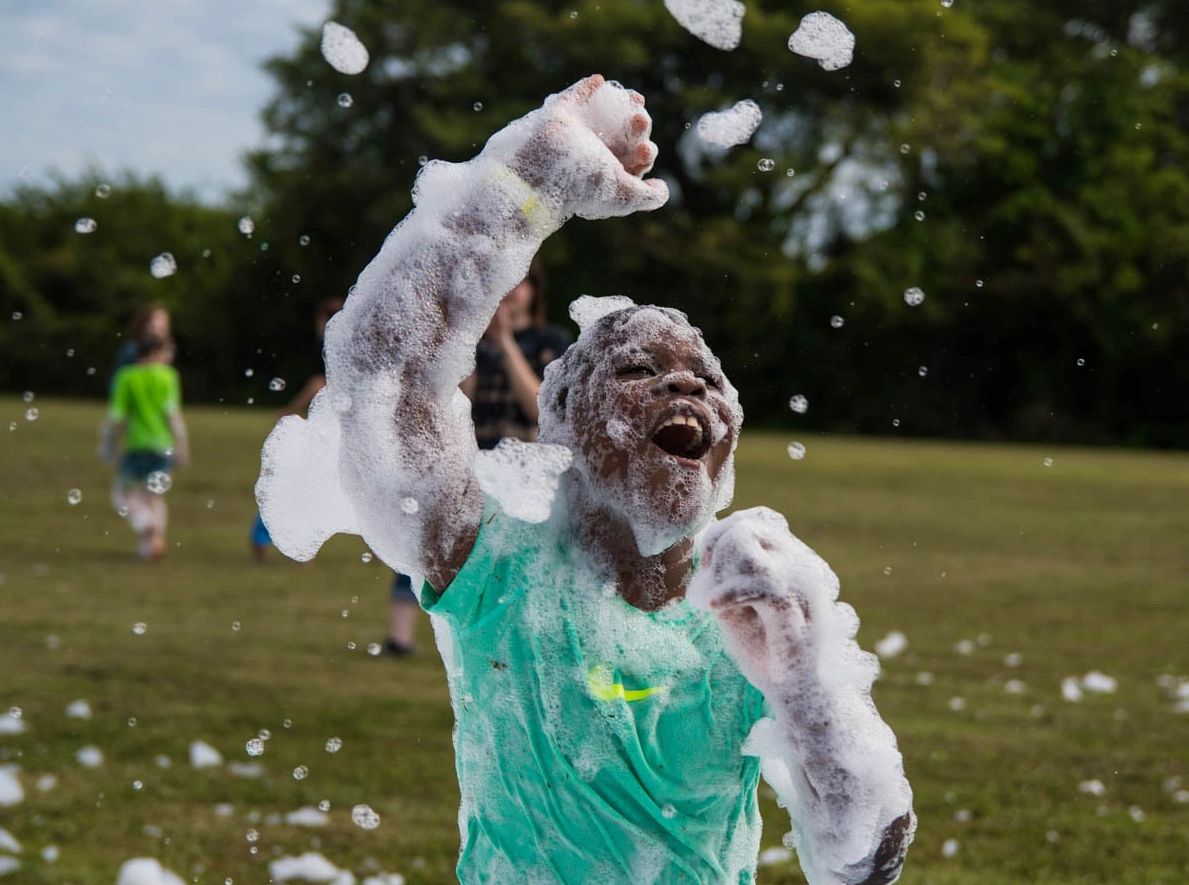 Child covered in foam