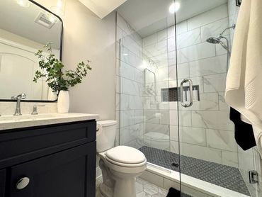 contemporary full bathroom with marble tile shower - pittsburgh bathroom remodeling