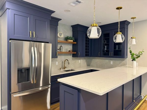 cambria quartz  with blue cabinets - custom home bar