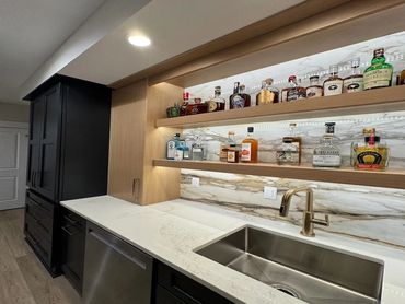 modern black and wood home bar - quartz stone backsplash - custom bars in pittsburgh pa