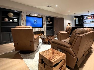 Luxury Basement renovation Custom paint bookcases and porcelain wall with TV - Pittsburgh, PA - Besp