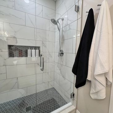 white marble walk in shower - bespoke kitchens and baths