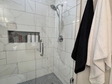 white marble walk in shower - pittsburgh bathroom design