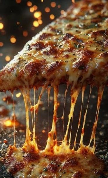 Close-up of cheesy pizza slice with melted cheese stretching.