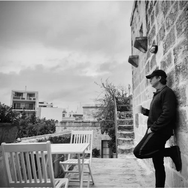 Dave enjoying a cup of morning coffee filming Karin Laing at L’Għarix Temple Retreat in Gozo, Malta.
